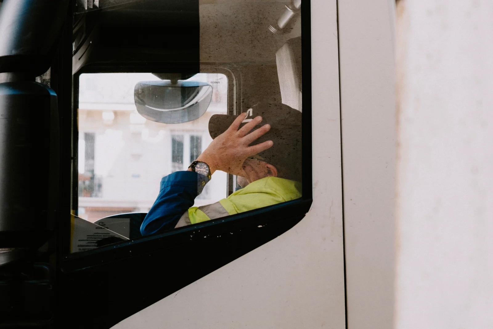A driver taking a quiet break inside a parked cab